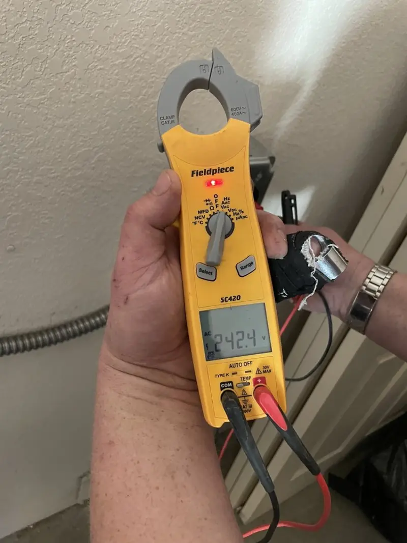 Voltage testing with clamp meter during Ceiling Fan Installation in Brookside